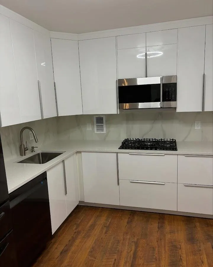 Restored kitchen with white cabinets after water damage in White City